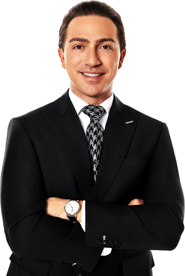 Blake Friedman smiling with his arms crossed