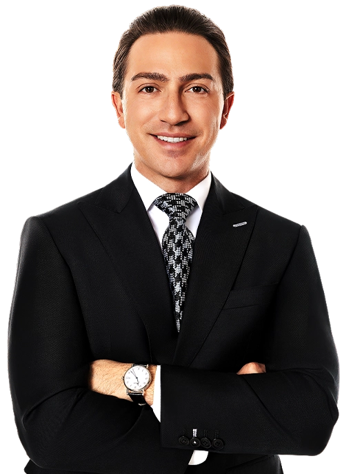 Blake Friedman smiling with his arms crossed